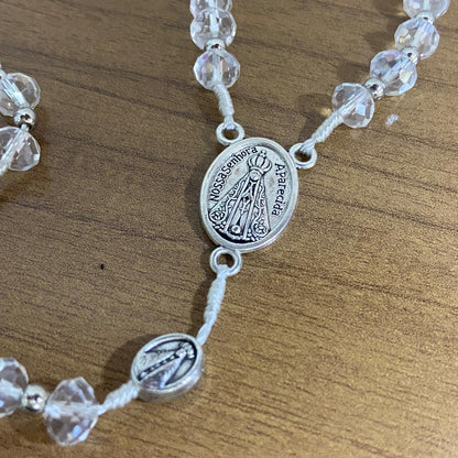 TERÇO CRISTAL NOSSA SENHORA APARECIDA  E SÃO CRISTÓVÃO 6 MM TRANSPARENTE  (1 UNIDADE)