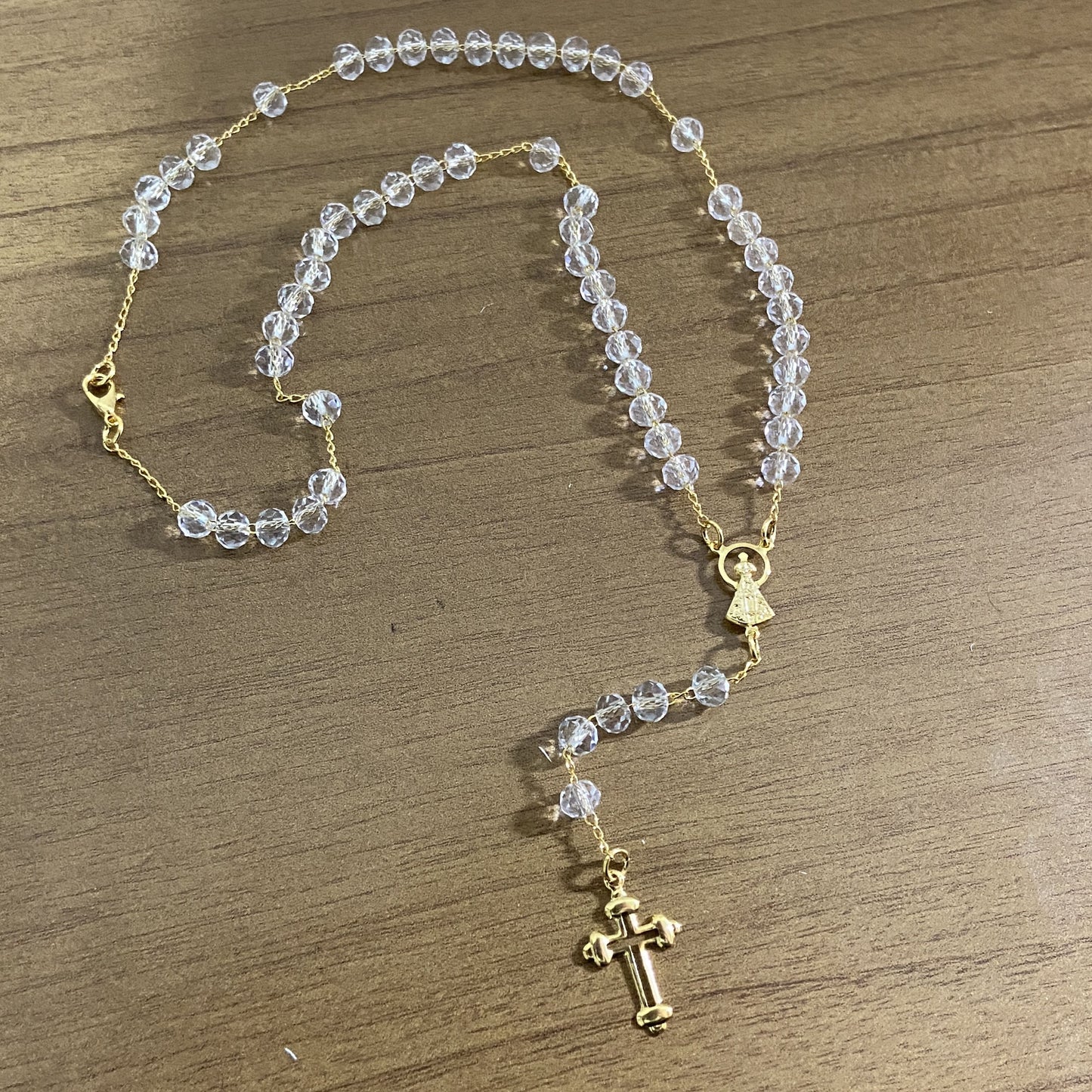 CORRENTE TERÇO CRISTAL NOSSA SENHORA APARECIDA TRANSPARENTE 04MM  (1 UNIDADE)