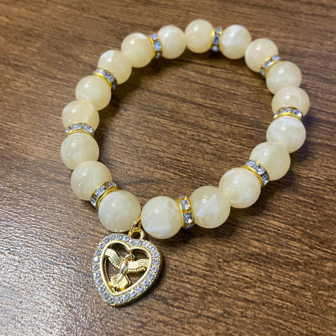 PULSEIRA PÉROLA BEGE COM PINGENTE DIVINO ESPÍRITO SANTO COM STRASS 08MM  (03 UNIDADES)
