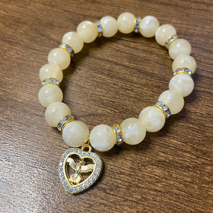 PULSEIRA PÉROLA BEGE COM PINGENTE DIVINO ESPÍRITO SANTO COM STRASS 08MM  (03 UNIDADES)