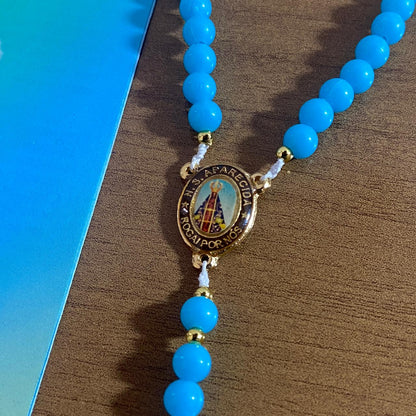 TERÇO PÉROLA AZUL NOSSA SENHORA APARECIDA 6MM (1 UNIDADE)