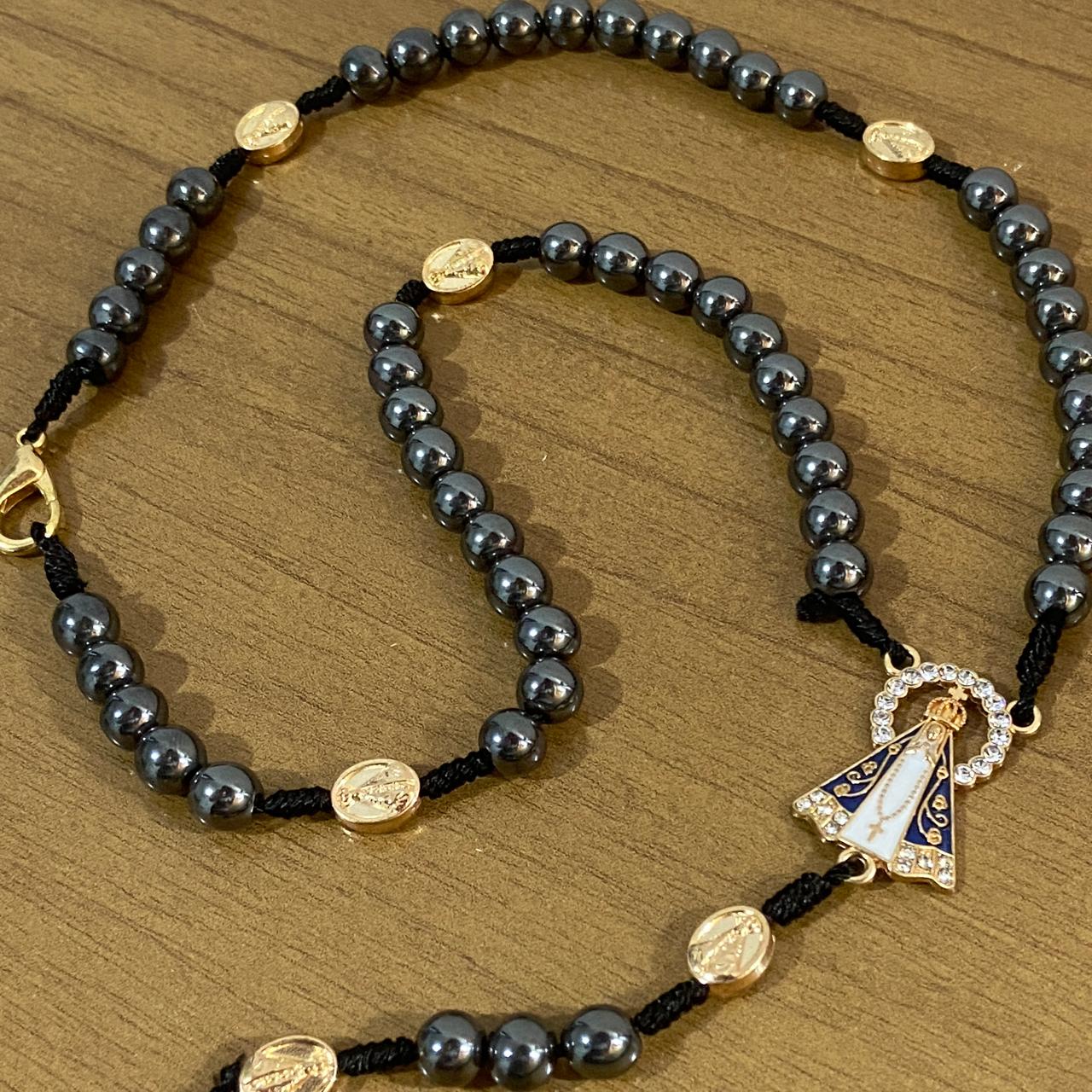 TERÇO DE HEMATITA NOSSA SENHORA APARECIDA 7 MEDALHAS 8MM (1 UNIDADE)