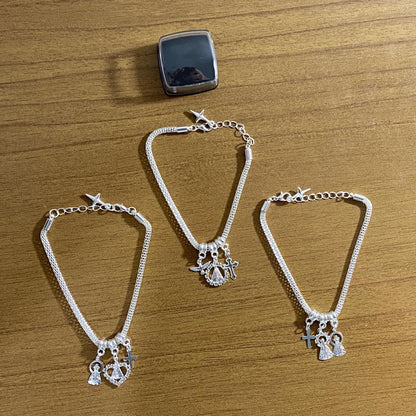 PULSEIRA PRATEADA NOSSA SENHORA APARECIDA MODELOS SORTIDOS COM STRASS (6 UNIDADES)