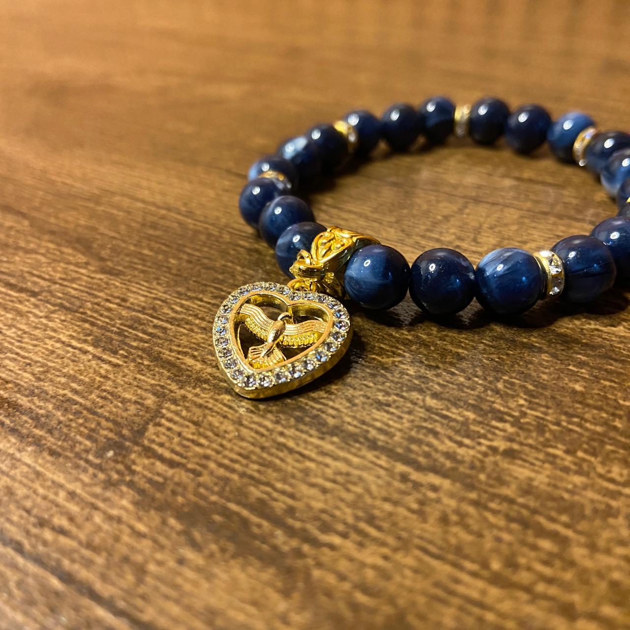 PULSEIRA PÉROLA AZUL COM PINGENTE DIVINO ESPÍRITO SANTO COM STRASS 08MM  (03 UNIDADES)