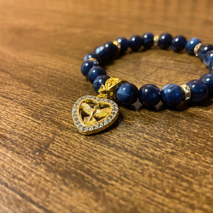 PULSEIRA PÉROLA AZUL COM PINGENTE DIVINO ESPÍRITO SANTO COM STRASS 08MM  (03 UNIDADES)