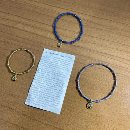 PULSEIRA DE MOLA COM MEDALHA SANTA TERESINHA CORES SORTIDAS  (3 UNIDADES)
