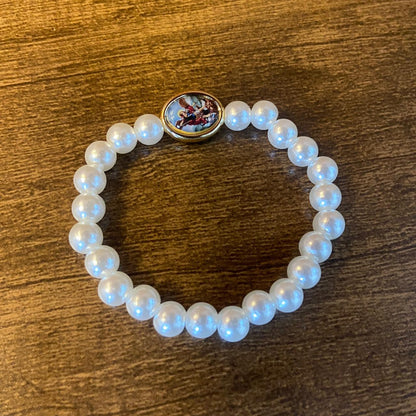 PULSEIRA PÉROLA COM MEDALHA RESINADA SÃO MIGUEL ARCANJO 08MM (06 UNIDADES)