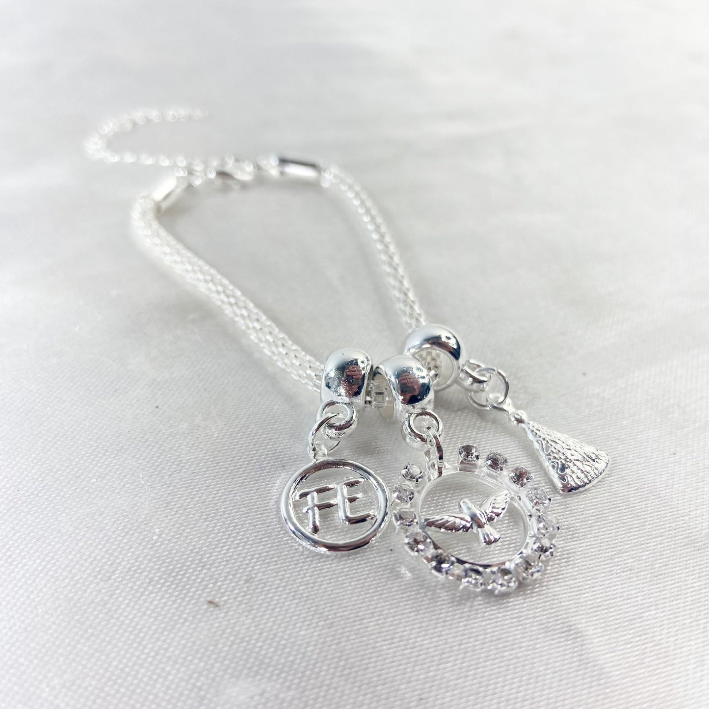 PULSEIRA NÍQUEL REDONDO DIVINO ESPIRITO SANTO COM STRASS BRANCO (6 UNIDADES)