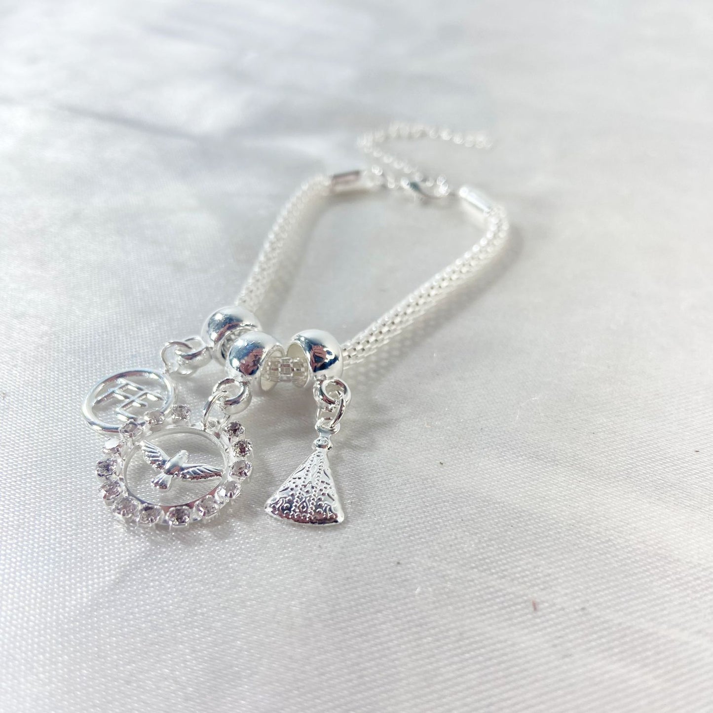 PULSEIRA NÍQUEL REDONDO DIVINO ESPIRITO SANTO COM STRASS BRANCO (6 UNIDADES)