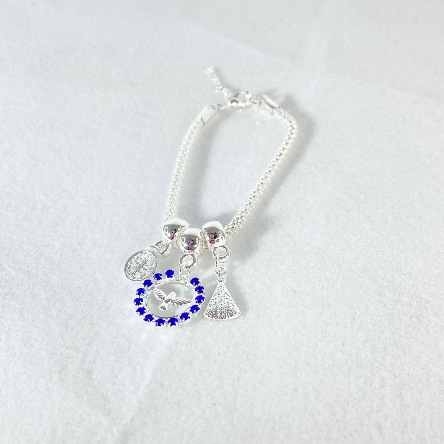 PULSEIRA NÍQUEL DIVINO ESPIRITO SANTO COM STRASS AZUL  (6 UNIDADES)