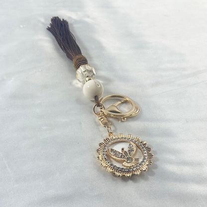 CHAVEIRO LUXO COM MOSQUETE DIVINO ESPÍRITO SANTO COM POMPOM MARROM (1 UNIDADE)